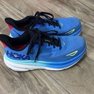 Hoka Men's Blue Athletic Shoes with Red and Yellow Accents